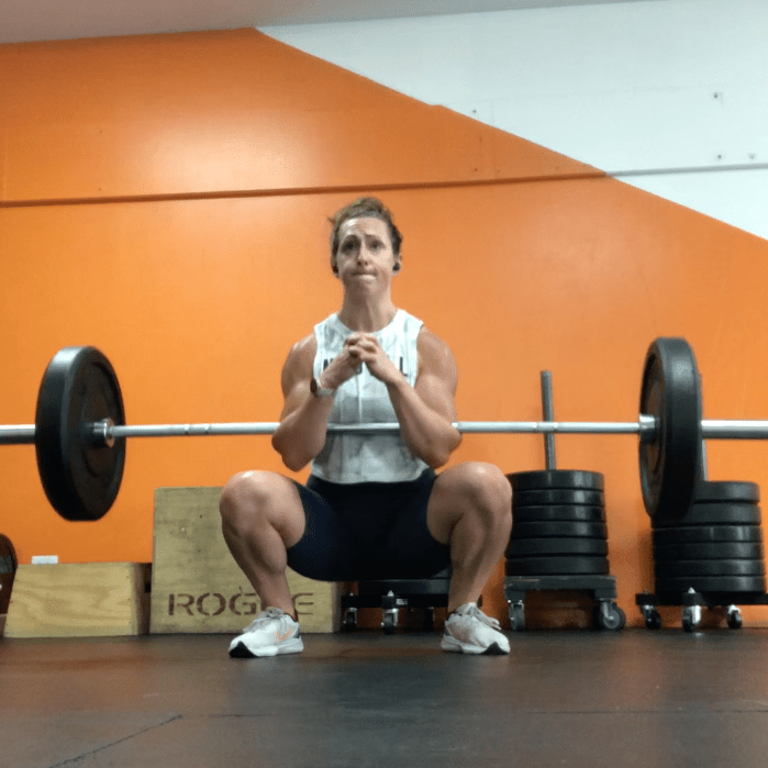 Haley lifting weight at a gym